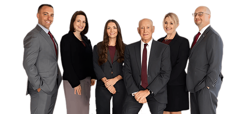 Group of six business professionals in formal attire posing together for a team photo.